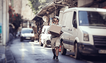 Delivery boy delivering a Box parcel