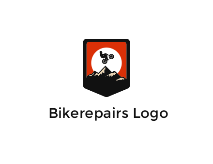 jumping bike and mountain emblem