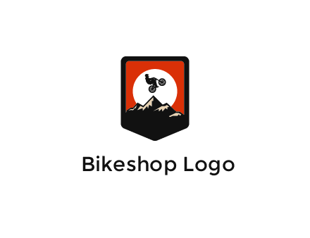 jumping bike and mountain emblem