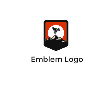 jumping bike and mountain emblem