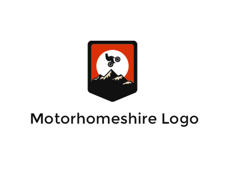 jumping bike and mountain emblem