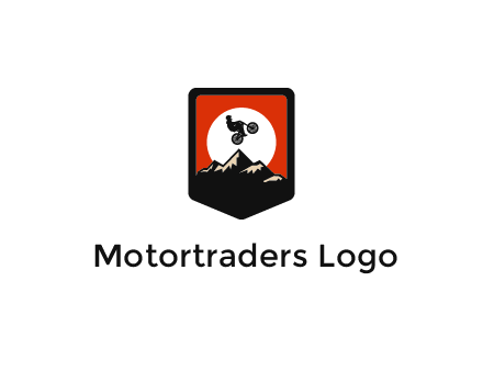 jumping bike and mountain emblem