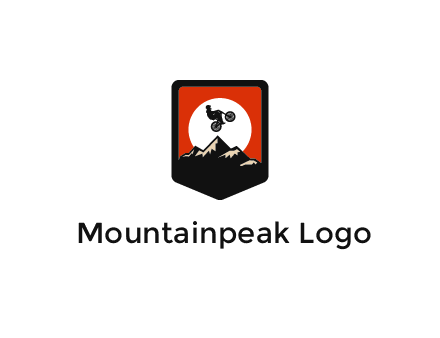 jumping bike and mountain emblem