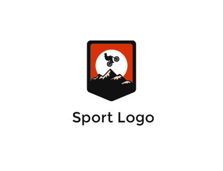 jumping bike and mountain emblem