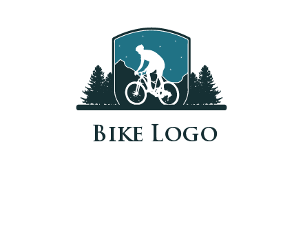 mountain biking in shield with trees emblem logo