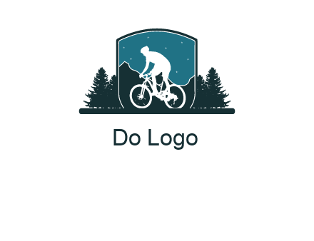 mountain biking in shield with trees emblem logo