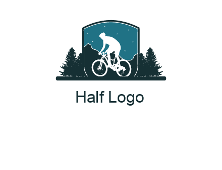 mountain biking in shield with trees emblem logo