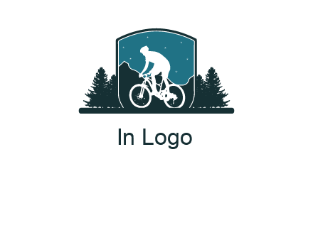 mountain biking in shield with trees emblem logo