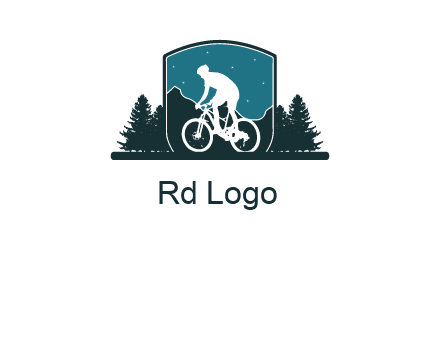 mountain biking in shield with trees emblem logo