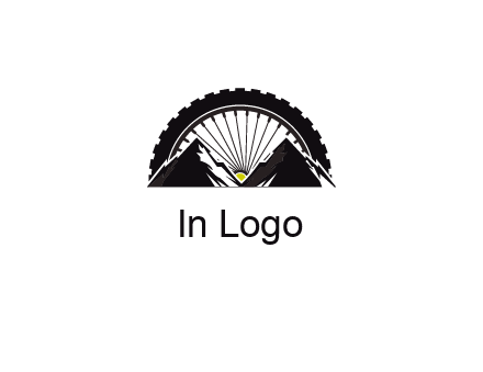 sun's rays forming a wheel behind mountains for a mountain biking logo