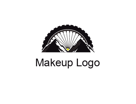 sun's rays forming a wheel behind mountains for a mountain biking logo