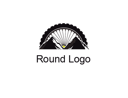 sun's rays forming a wheel behind mountains for a mountain biking logo