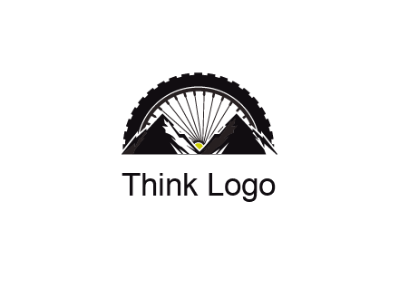 sun's rays forming a wheel behind mountains for a mountain biking logo