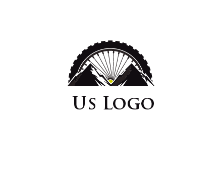 sun's rays forming a wheel behind mountains for a mountain biking logo