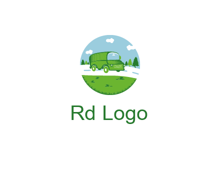 Camper van or bus on a road surrounded by grass, trees and the blue sky