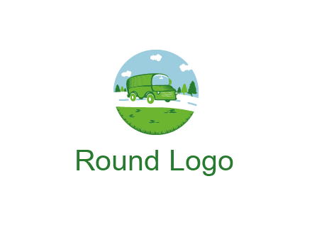 Camper van or bus on a road surrounded by grass, trees and the blue sky