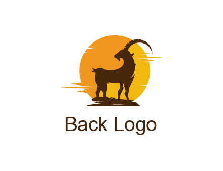sun behind mountain goat standing on the cliff