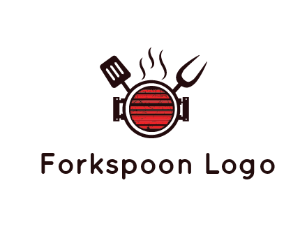 cooking utensils behind grill with steam