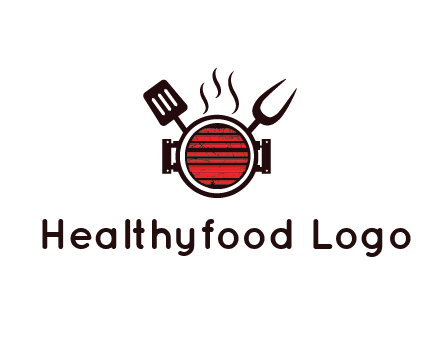 cooking utensils behind grill with steam