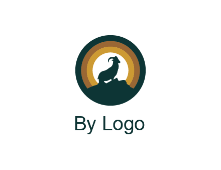 mountain goat silhouette standing on cliff in circle