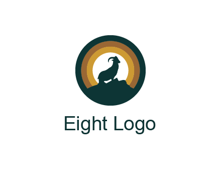 mountain goat silhouette standing on cliff in circle