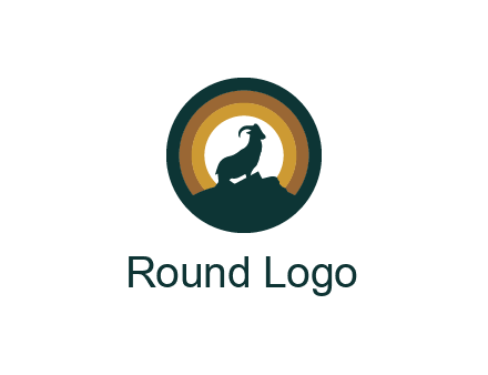 mountain goat silhouette standing on cliff in circle