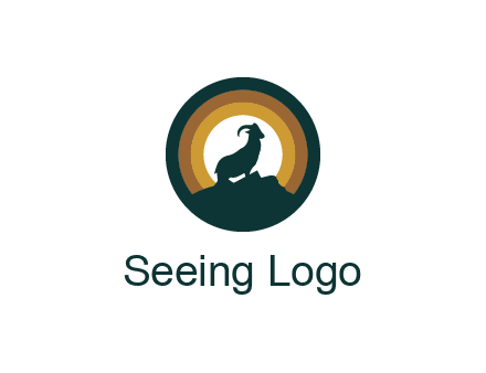 mountain goat silhouette standing on cliff in circle
