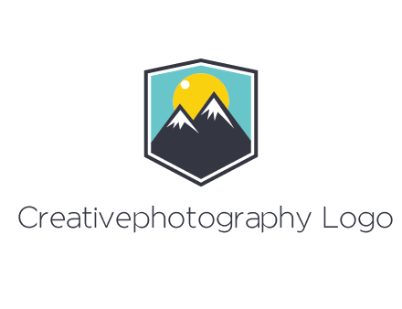 sun behind mountain in frame