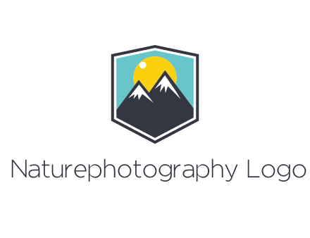 sun behind mountain in frame