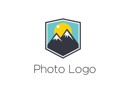 sun behind mountain in frame