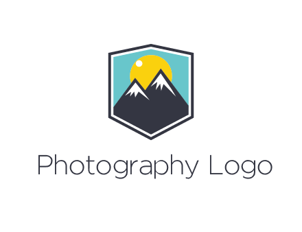 sun behind mountain in frame