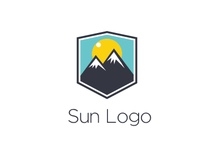 sun behind mountain in frame