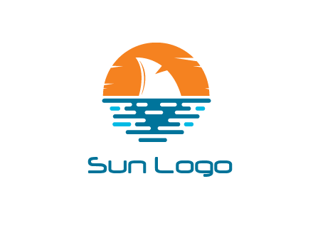 sun behind shark fin in sea