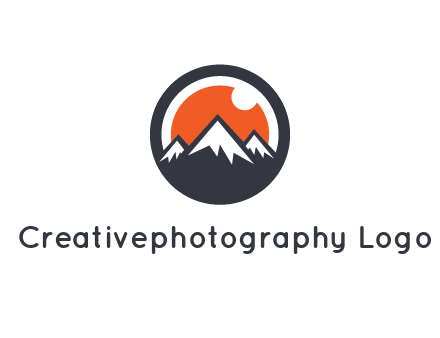 sun as camera lens behind snow caped mountains in circle