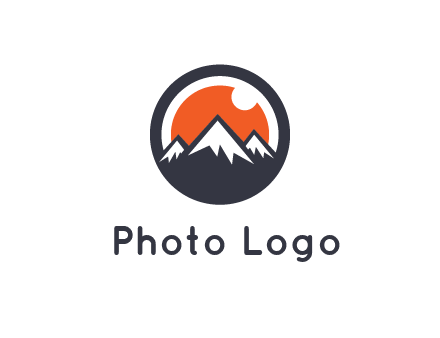 sun as camera lens behind snow caped mountains in circle
