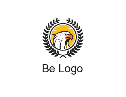 eagle face in circle with leaves