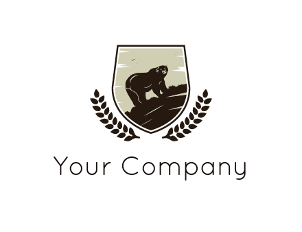 bear climbing hill in shield with leaves