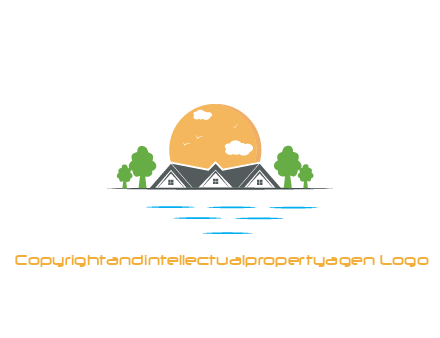sun behind houses with trees and lake